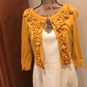 Knit shrug with ruffle detail